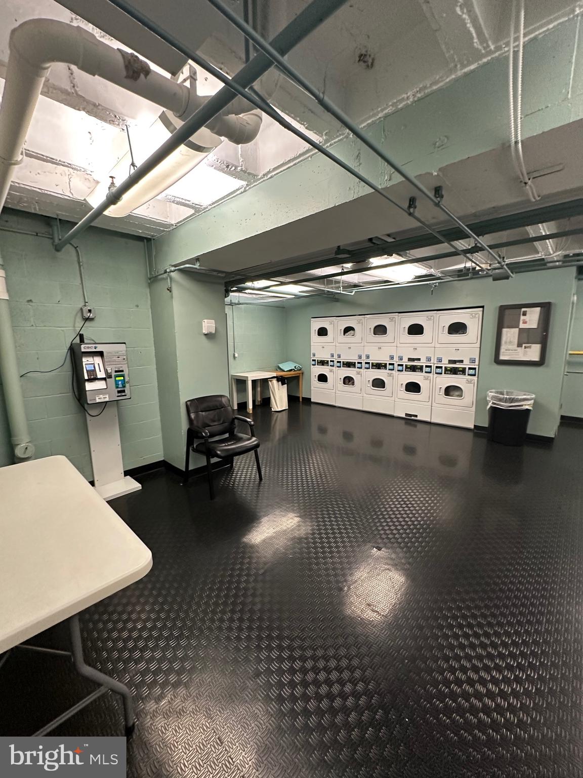 1101 3rd Street Southwest, Unit 306 Washington, DC 20024 - Photo 42 of 53 a living room with furniture and a chandelier