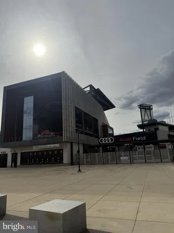 a view of roof deck with table and chairs