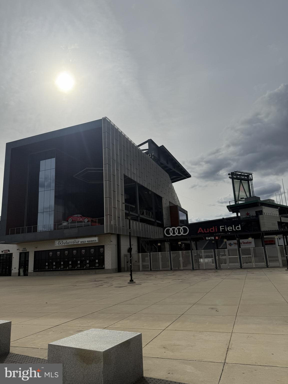 1101 3rd Street Southwest, Unit 306 Washington, DC 20024 - Photo 49 of 53 a living room with furniture a flat screen tv and kitchen view