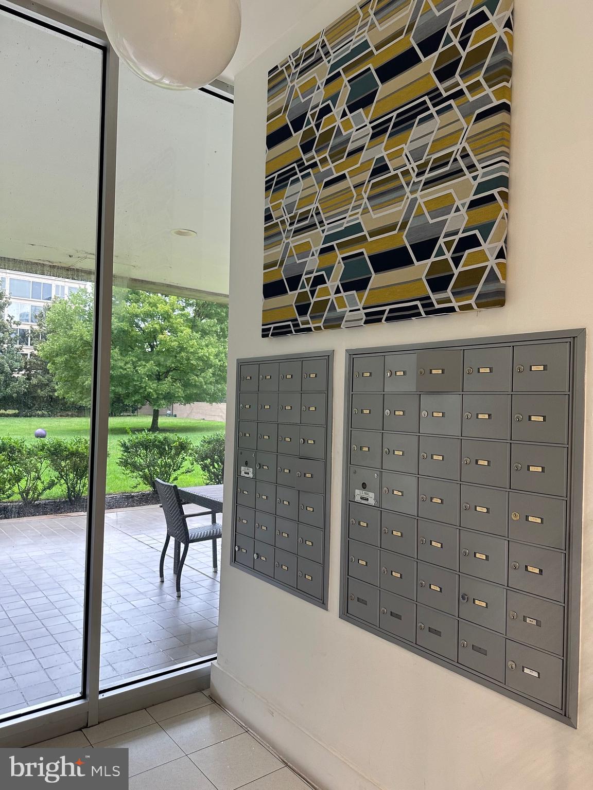 1101 3rd Street Southwest, Unit 306 Washington, DC 20024 - Photo 5 of 53 a view of a balcony with table and chairs