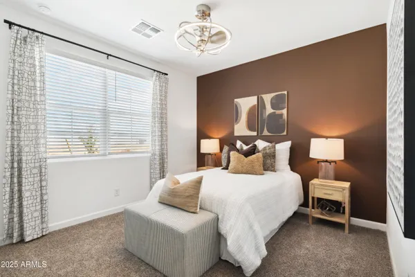 a bedroom with bed and window
