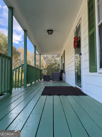 a view of a balcony with wooden floor