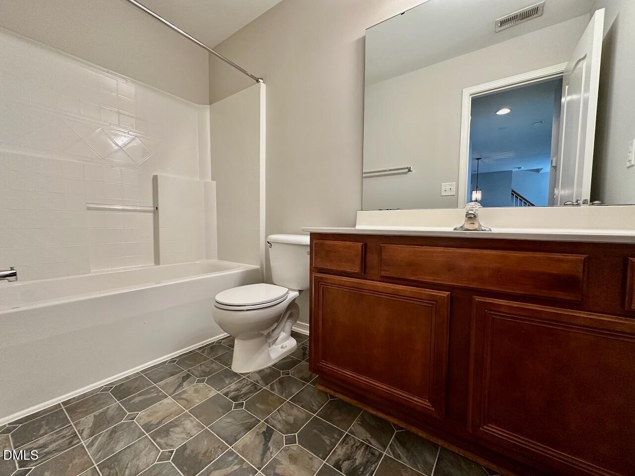 8208 Stone Cellar Drive Raleigh, NC 27613 - Photo 29 of 34 a bathroom with a sink a toilet and a bathtub