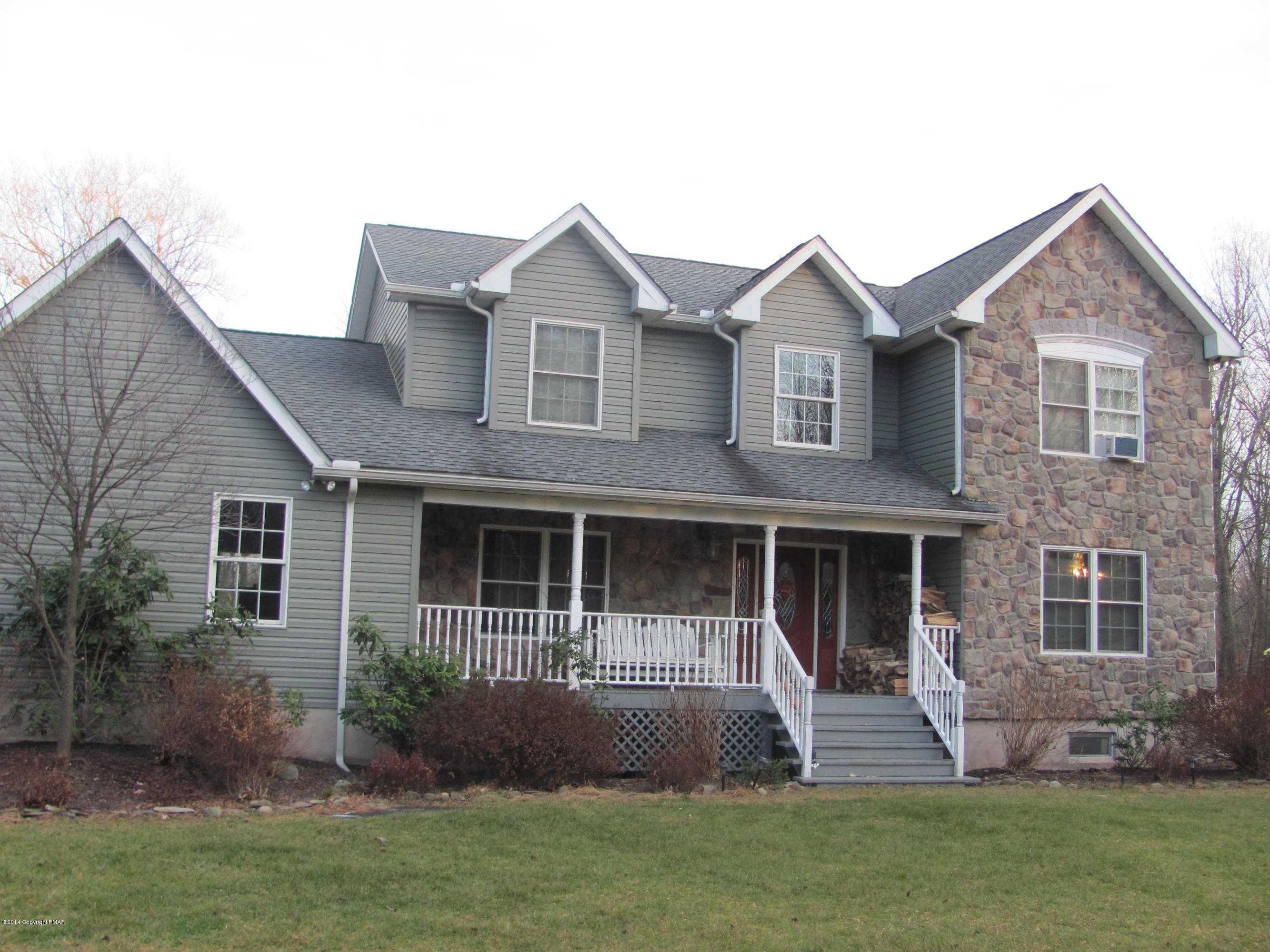 442 Henry's Crossing Road Cresco, PA 18326 - Photo 1 of 20 a front view of a house with a yard
