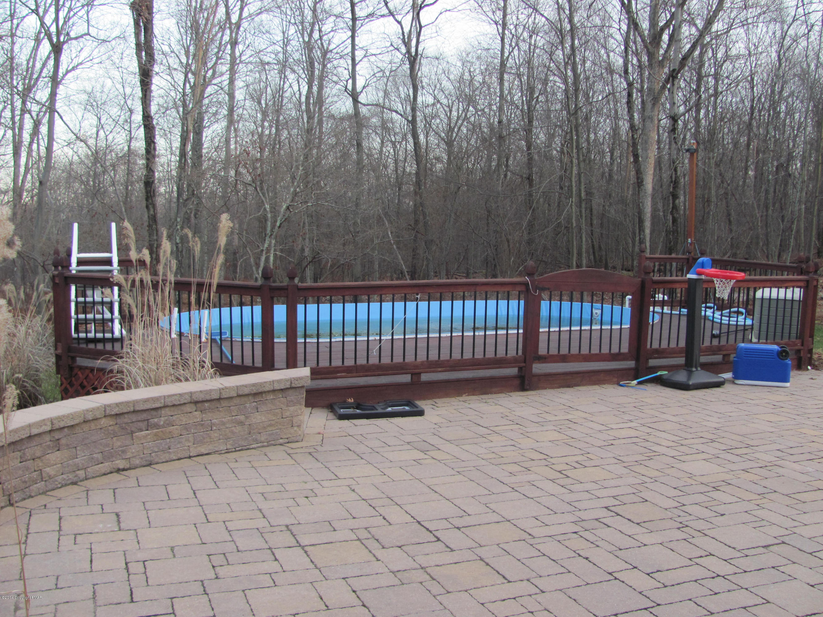 442 Henry's Crossing Road Cresco, PA 18326 - Photo 20 of 20 a view of deck with wooden fence and trees
