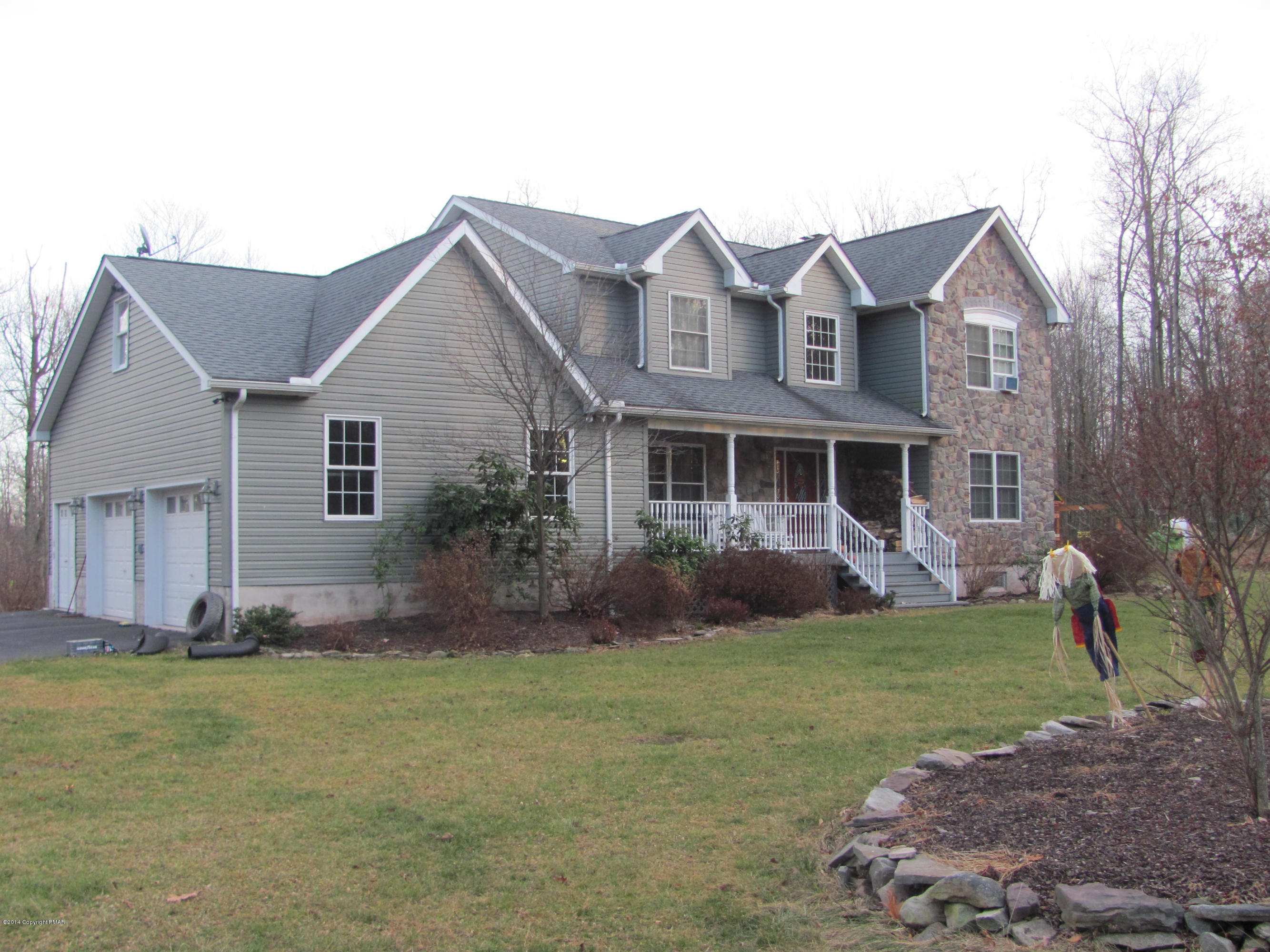 442 Henry's Crossing Road Cresco, PA 18326 - Photo 2 of 20 a front view of a house with a garden and yard