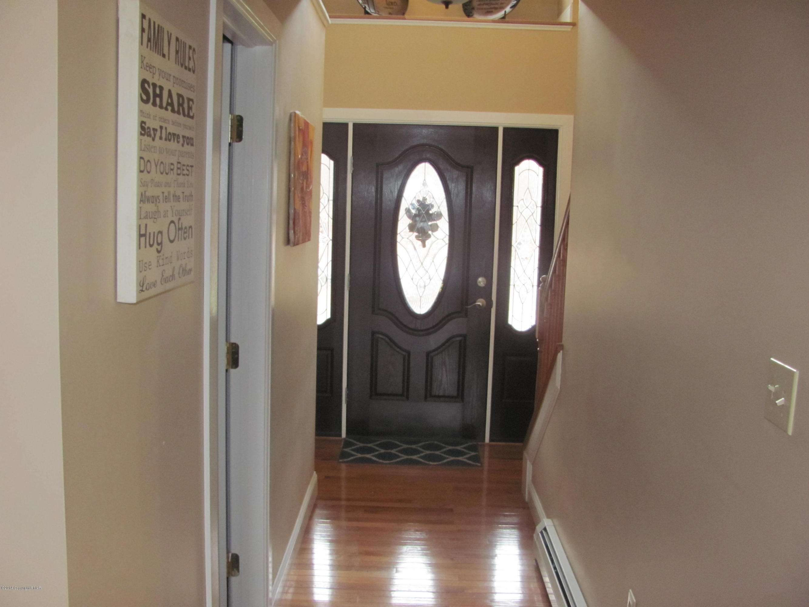 442 Henry's Crossing Road Cresco, PA 18326 - Photo 3 of 20 a view of a entryway door with wooden floor