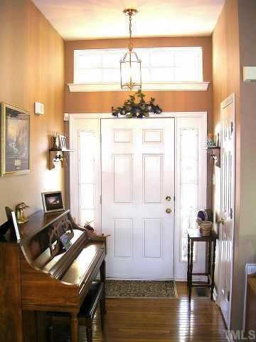 640 Deacon Ridge Street Wake Forest, NC 27587 - Photo 5 of 9 Click on this foyer picture to see it in proper perspective. The foyer has plenty of natural light from the transom window and two side light windows. Hardwood floors are in foyer, LR, DR, Kitchen and sunroom. Other