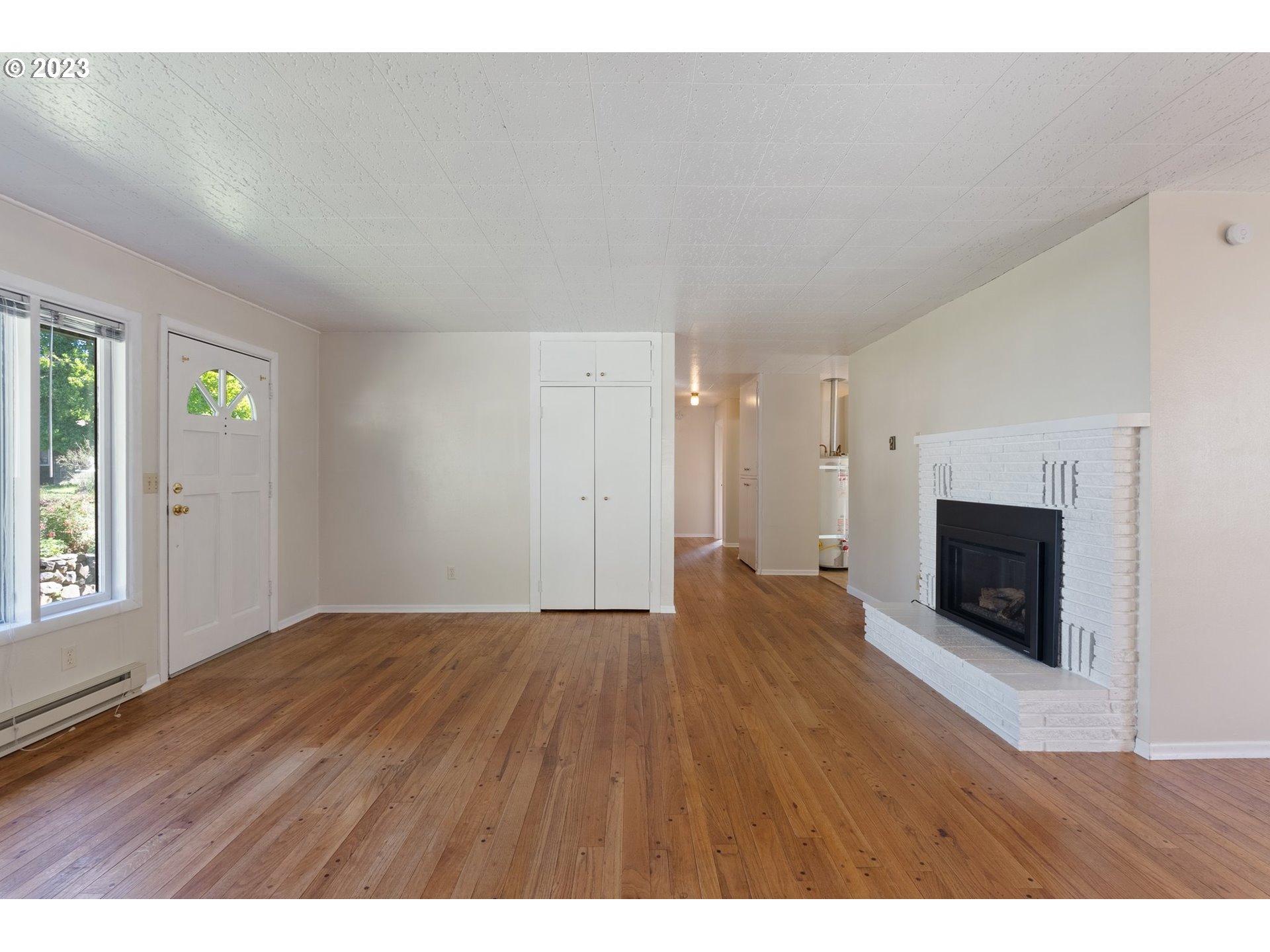 477 Northwest Chesser Road Stevenson, WA 98648 - Photo 27 of 40 a view of an empty room with window and fire place