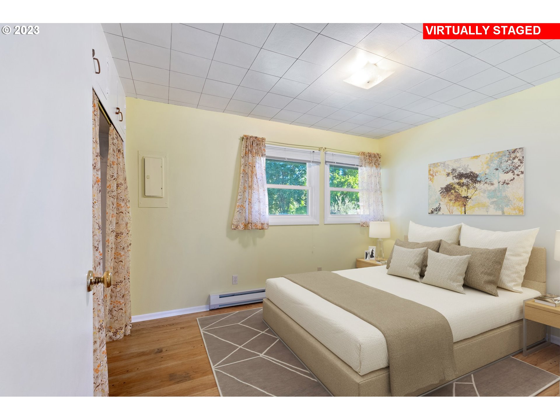 477 Northwest Chesser Road Stevenson, WA 98648 - Photo 3 of 40 a bedroom with a bed and a painting on the wall