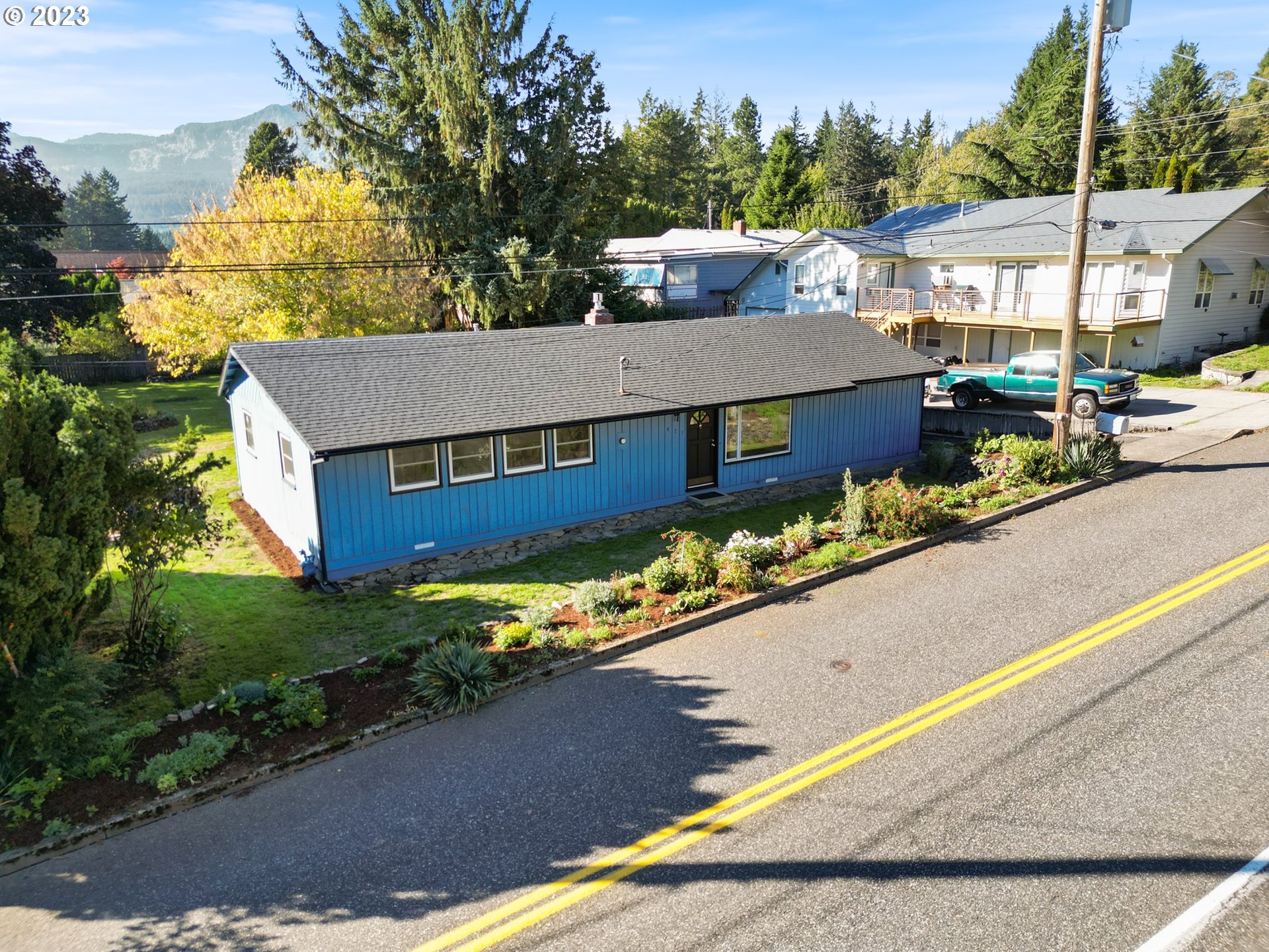 477 Northwest Chesser Road Stevenson, WA 98648 - Photo 4 of 40 an aerial view of a house with a yard basket ball court and outdoor seating