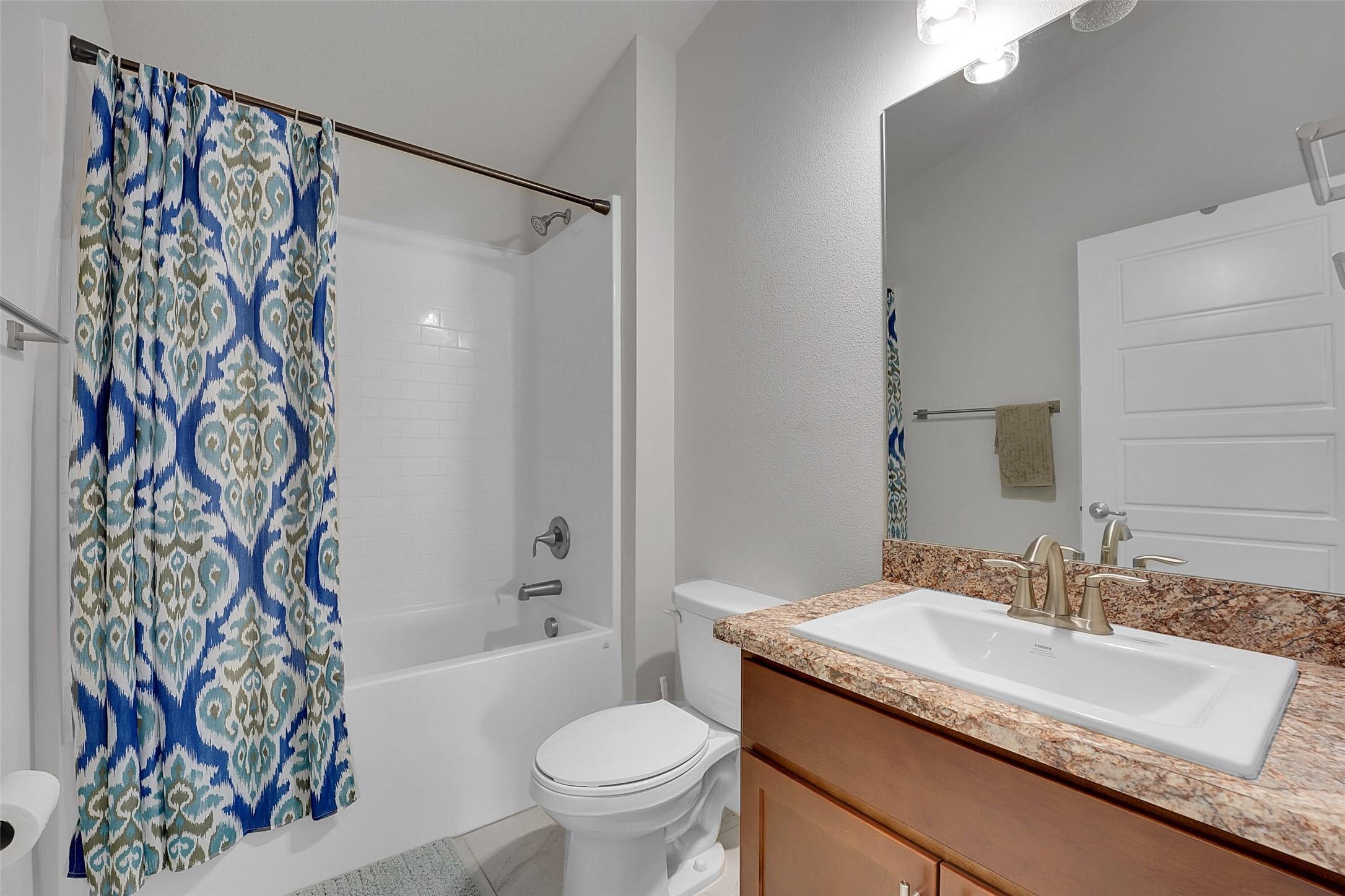 8600 Merano Avenue Fort Pierce, FL 34951 - Photo 15 of 22 a bathroom with a granite countertop sink and a mirror