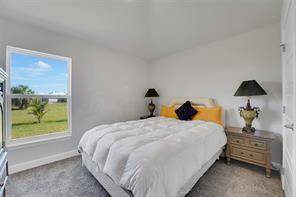 8600 Merano Avenue Fort Pierce, FL 34951 - Photo 16 of 22 a bedroom with a bed and window