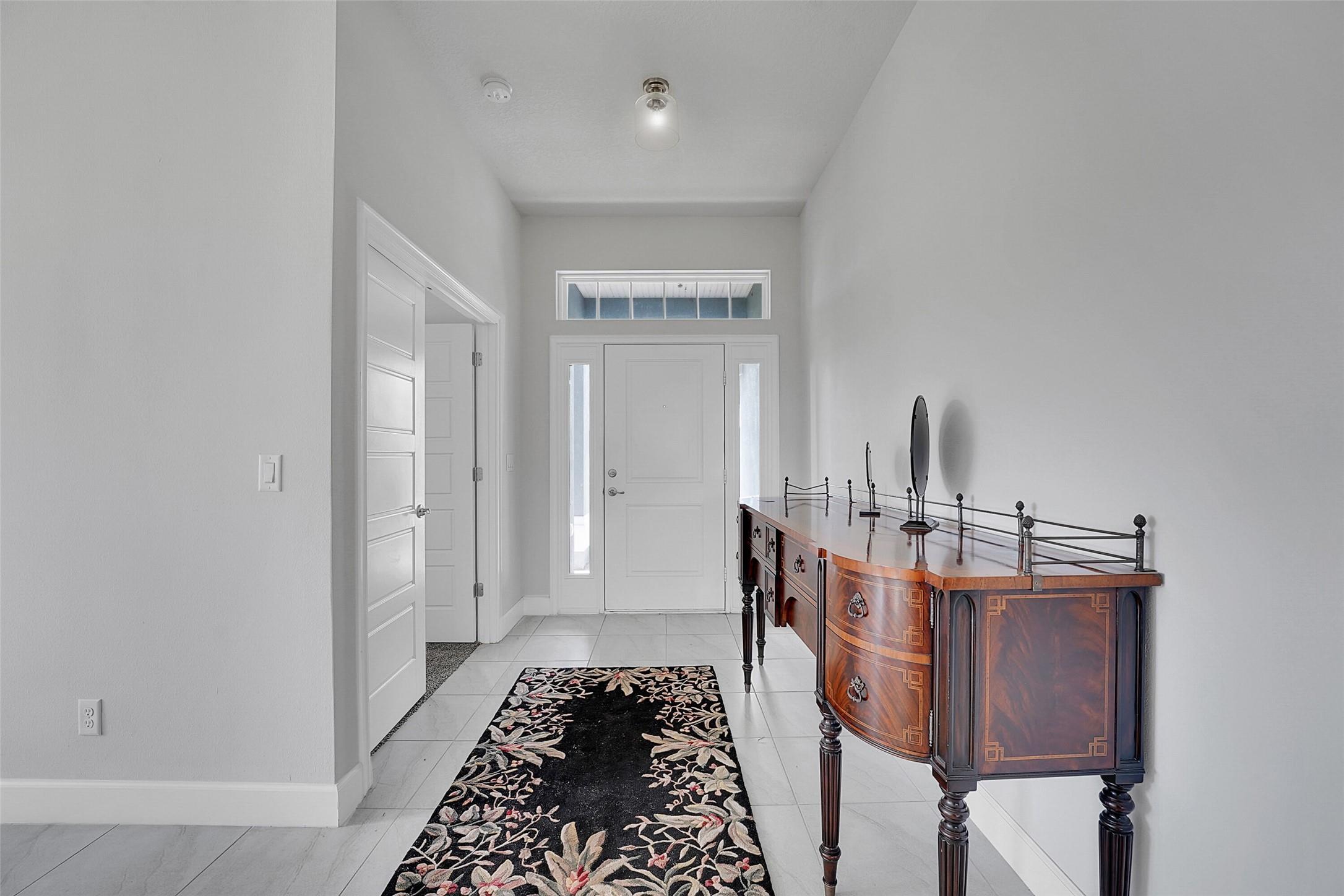 8600 Merano Avenue Fort Pierce, FL 34951 - Photo 2 of 22 a living room with furniture and a rug