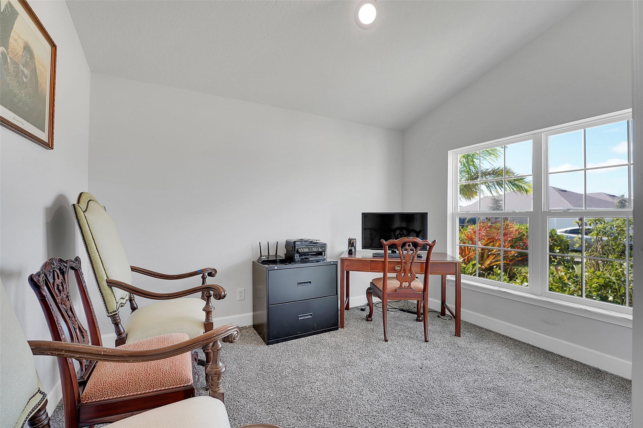 8600 Merano Avenue Fort Pierce, FL 34951 - Photo 21 of 22 a living room with furniture and a flat screen tv