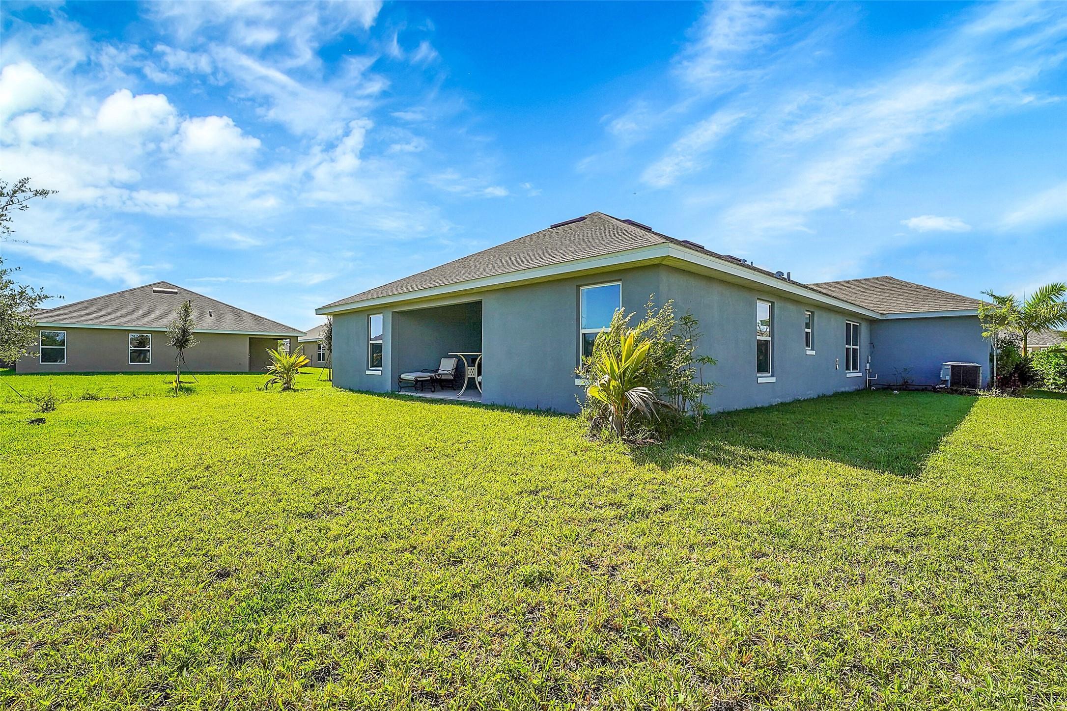 8600 Merano Avenue Fort Pierce, FL 34951 - Photo 22 of 22 a front view of house with garden