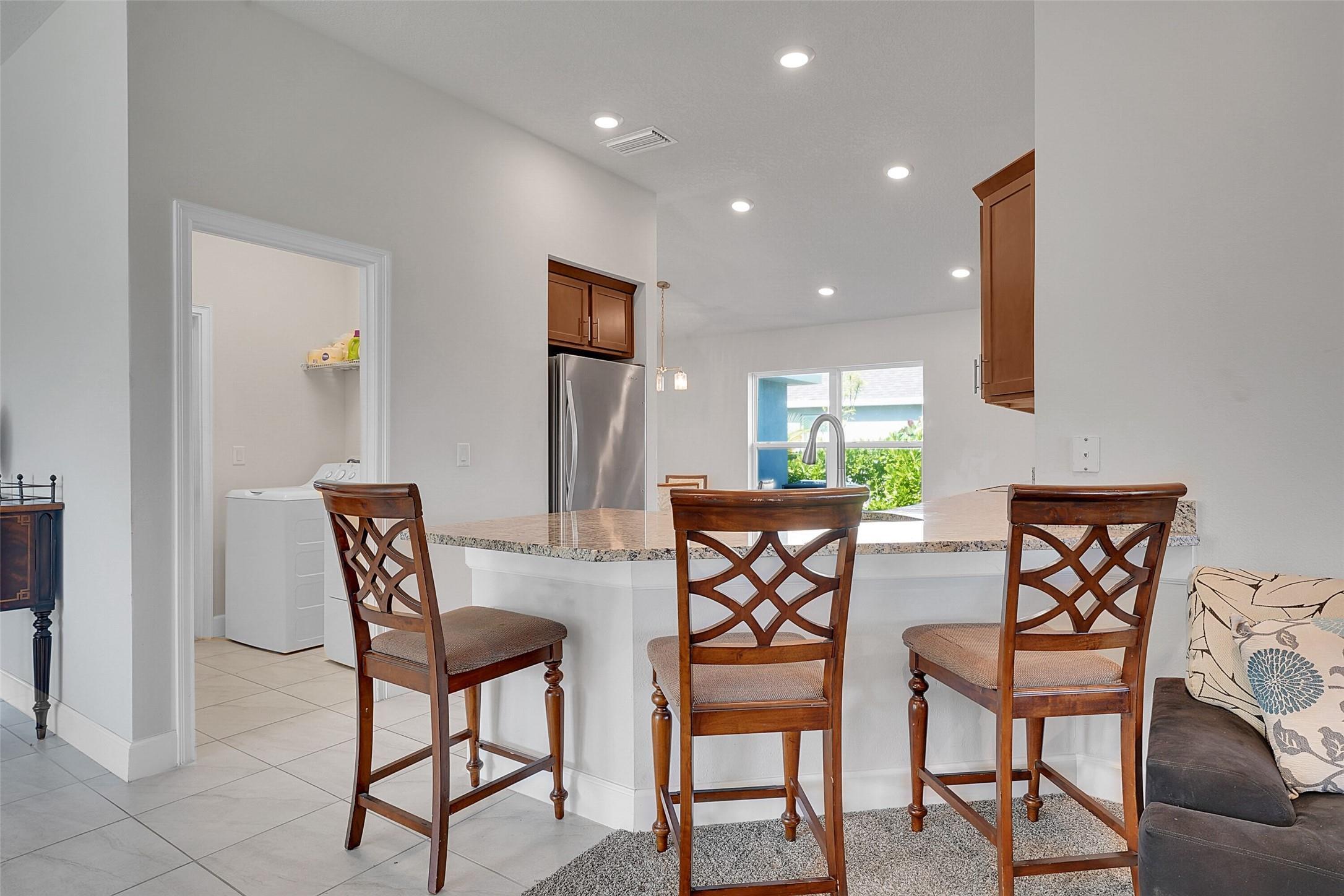 8600 Merano Avenue Fort Pierce, FL 34951 - Photo 7 of 22 a dining room with furniture and a window