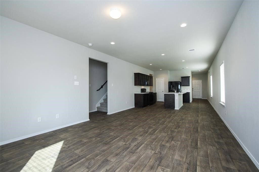 4023 Wyanngate Drive Spring, TX 77373 - Photo 11 of 23 a view of kitchen with refrigerator stove microwave and cabinets