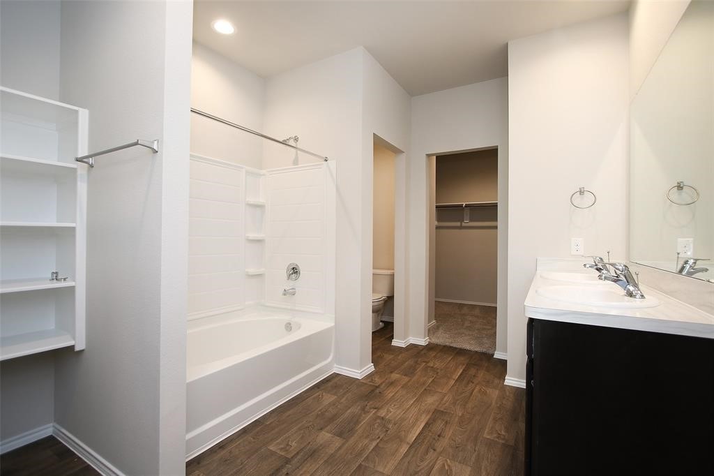 4023 Wyanngate Drive Spring, TX 77373 - Photo 17 of 23 a bathroom with a bathtub and a sink