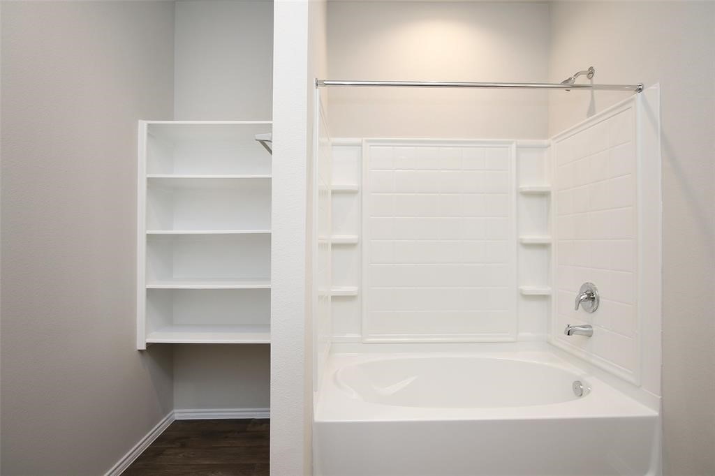 4023 Wyanngate Drive Spring, TX 77373 - Photo 18 of 23 a bathroom with a bathtub