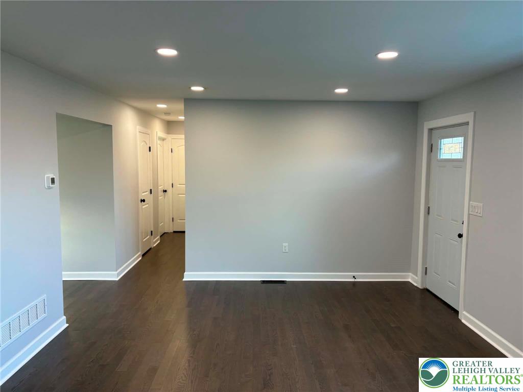 3957 Mountain Road Slatington, PA 18080 - Photo 8 of 33 an empty room with wooden floor and windows