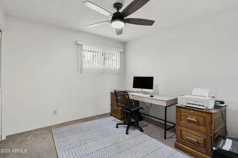 a view of a workspace with furniture