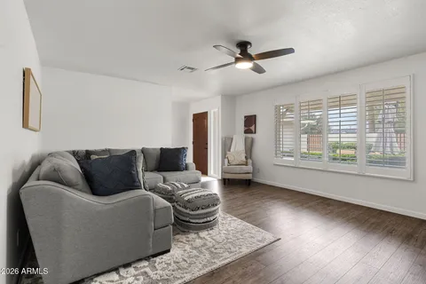 a living room with furniture and a large window