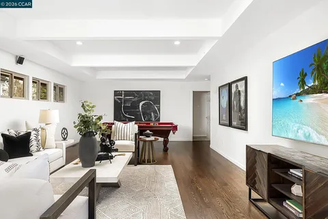 a patio with yard glass top table and chairs