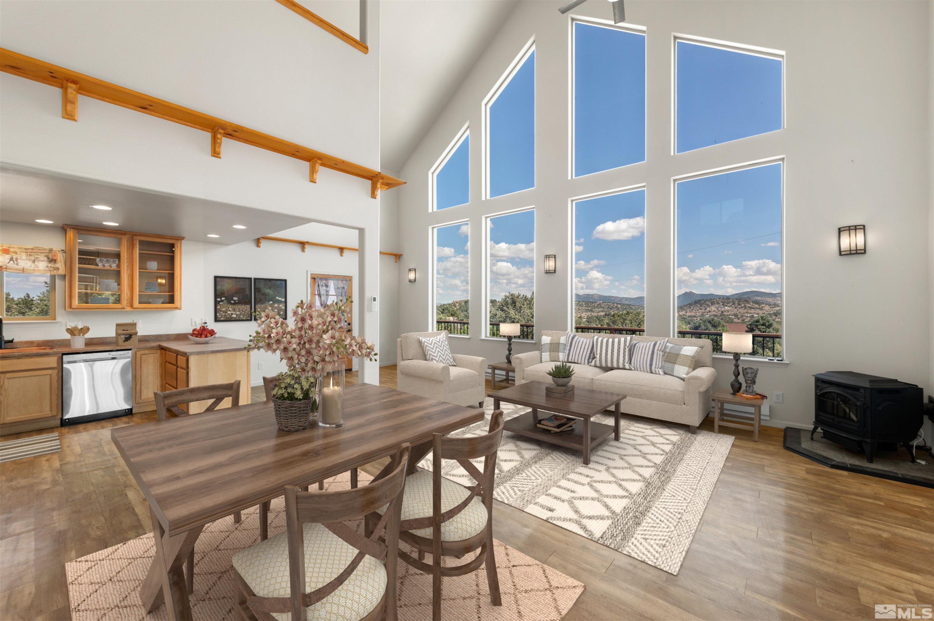 1530 Bonanza Road Reno, NV 89521 - Photo 3 of 38 a living room with furniture a wooden floor and a large window