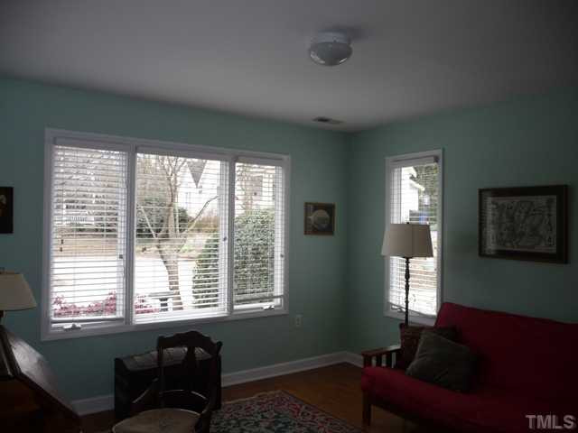 609 Leonidas Court Raleigh, NC 27604 - Photo 8 of 25 Office, studio, guest room all are options for using the versatile, south facing, front bedroom that overlooks the cul-de-sac. Note the hardwood floors in all rooms except the baths and middle bedroom.