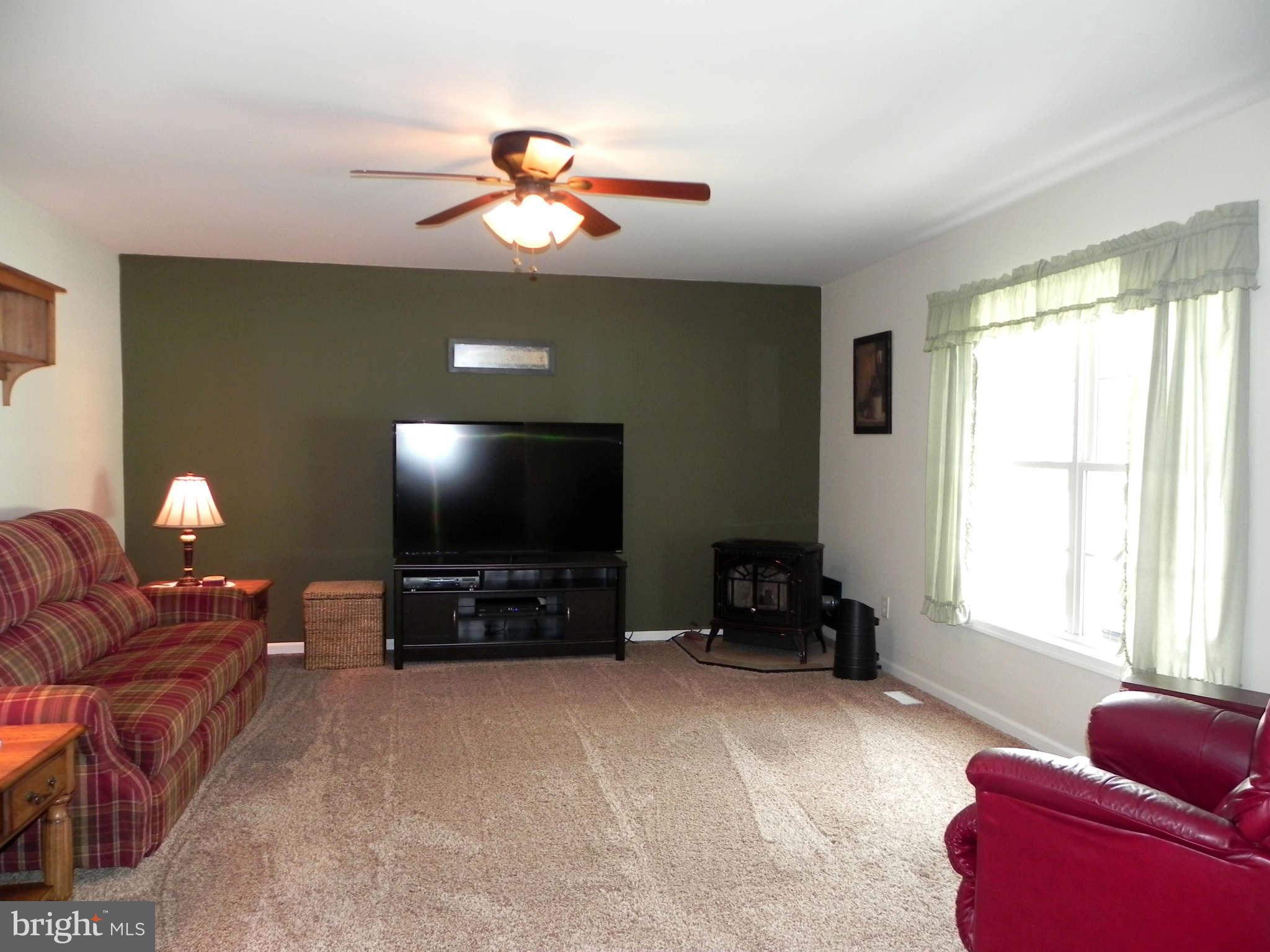 293 Fantasia Road Inwood, WV 25428 - Photo 12 of 30 Family Room w/ Pellet Stove