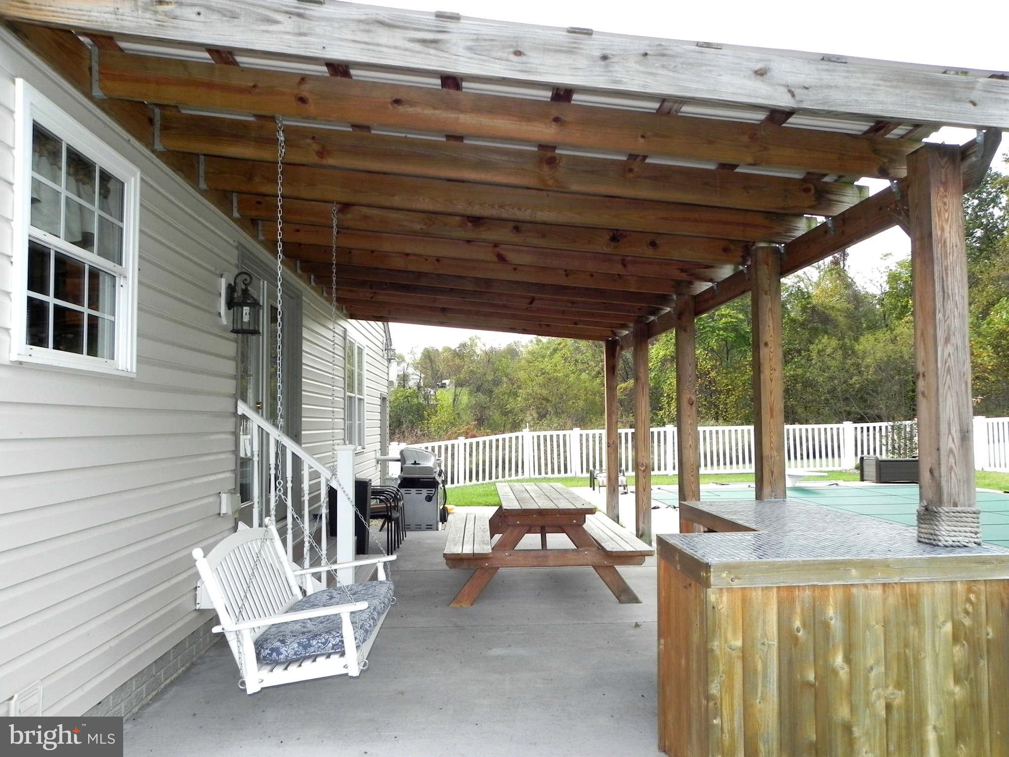 293 Fantasia Road Inwood, WV 25428 - Photo 27 of 30 Covered Patio w/ Bar