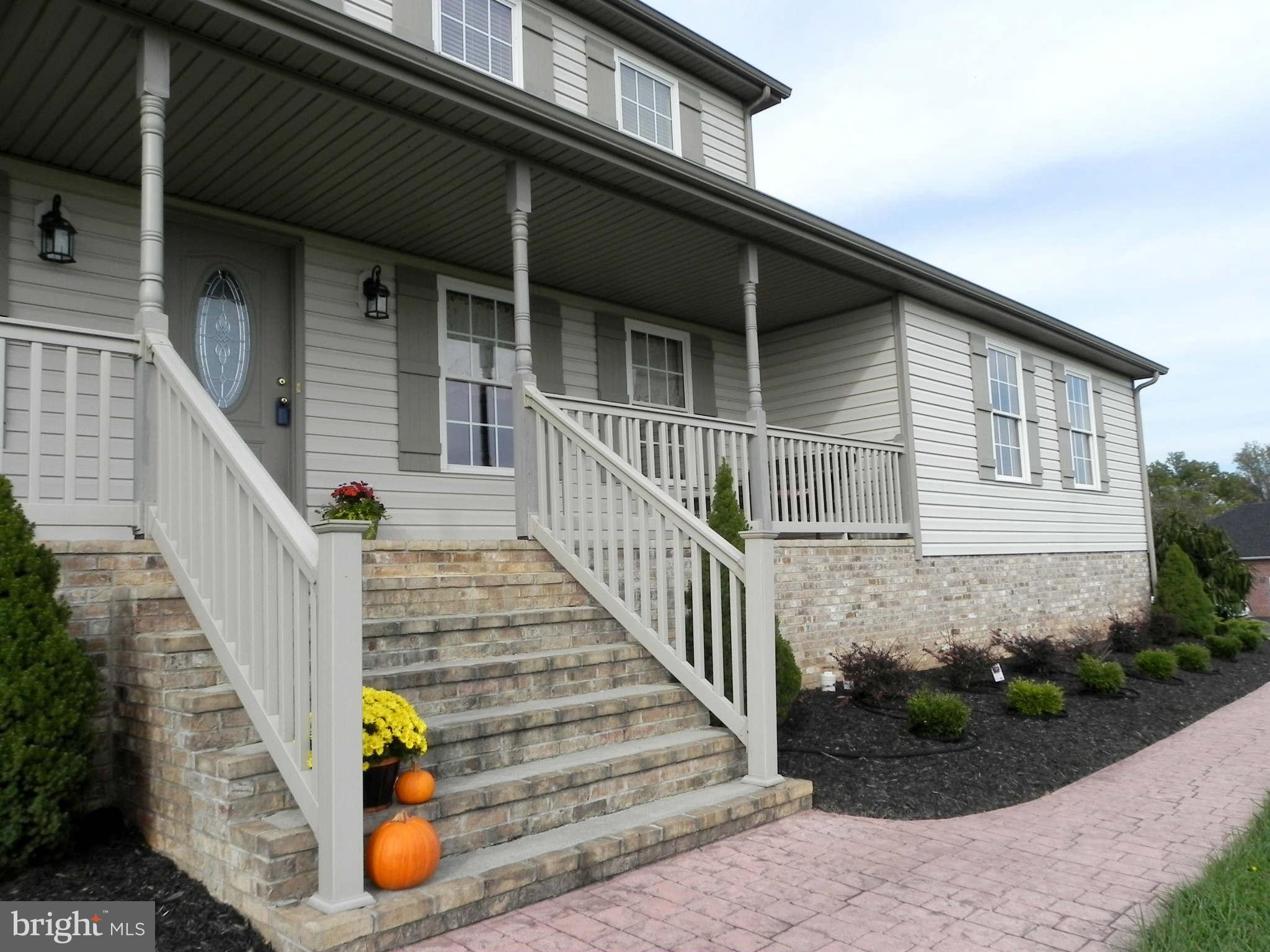 293 Fantasia Road Inwood, WV 25428 - Photo 5 of 30 Front Landscaping & Brick Sidewalk