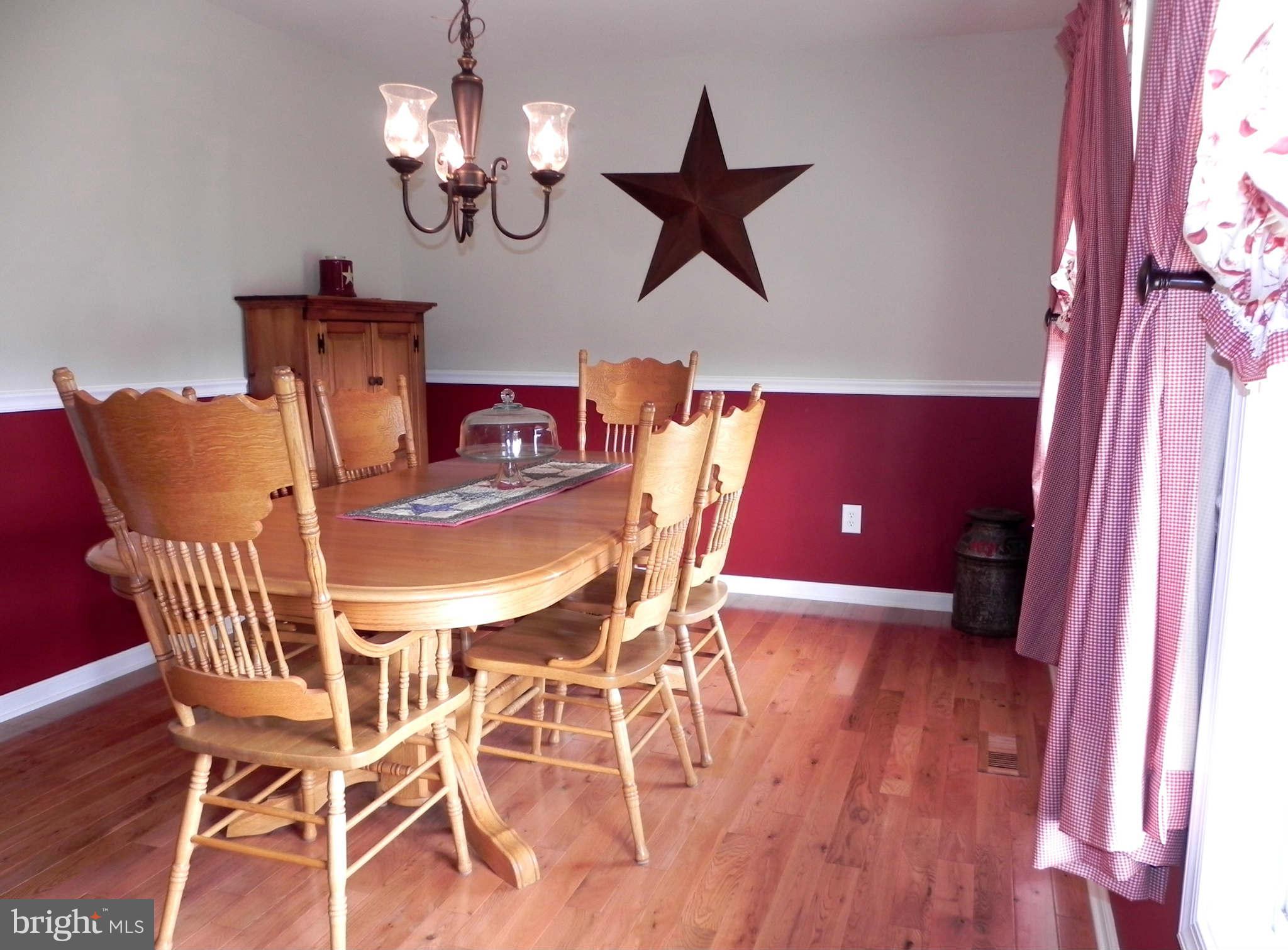 293 Fantasia Road Inwood, WV 25428 - Photo 8 of 30 Dining Room w/ Hardwood Floor