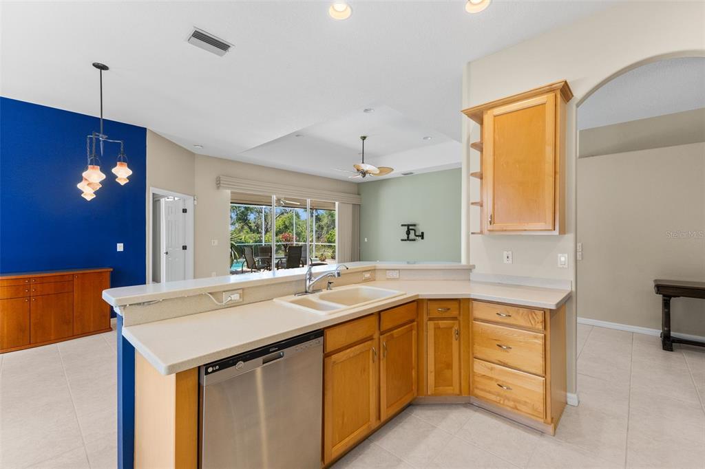 6532 Copper Ridge Trail Bradenton, FL 34201 - Photo 24 of 42 Kitchen faces out to the dining room and living room