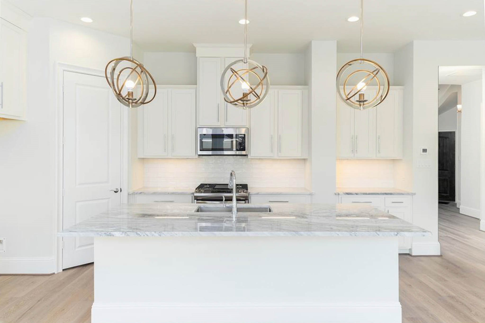 7715 South Fall Run Crossing Houston, TX 77055 - Photo 22 of 22 a view of a kitchen with granite countertop and a clock