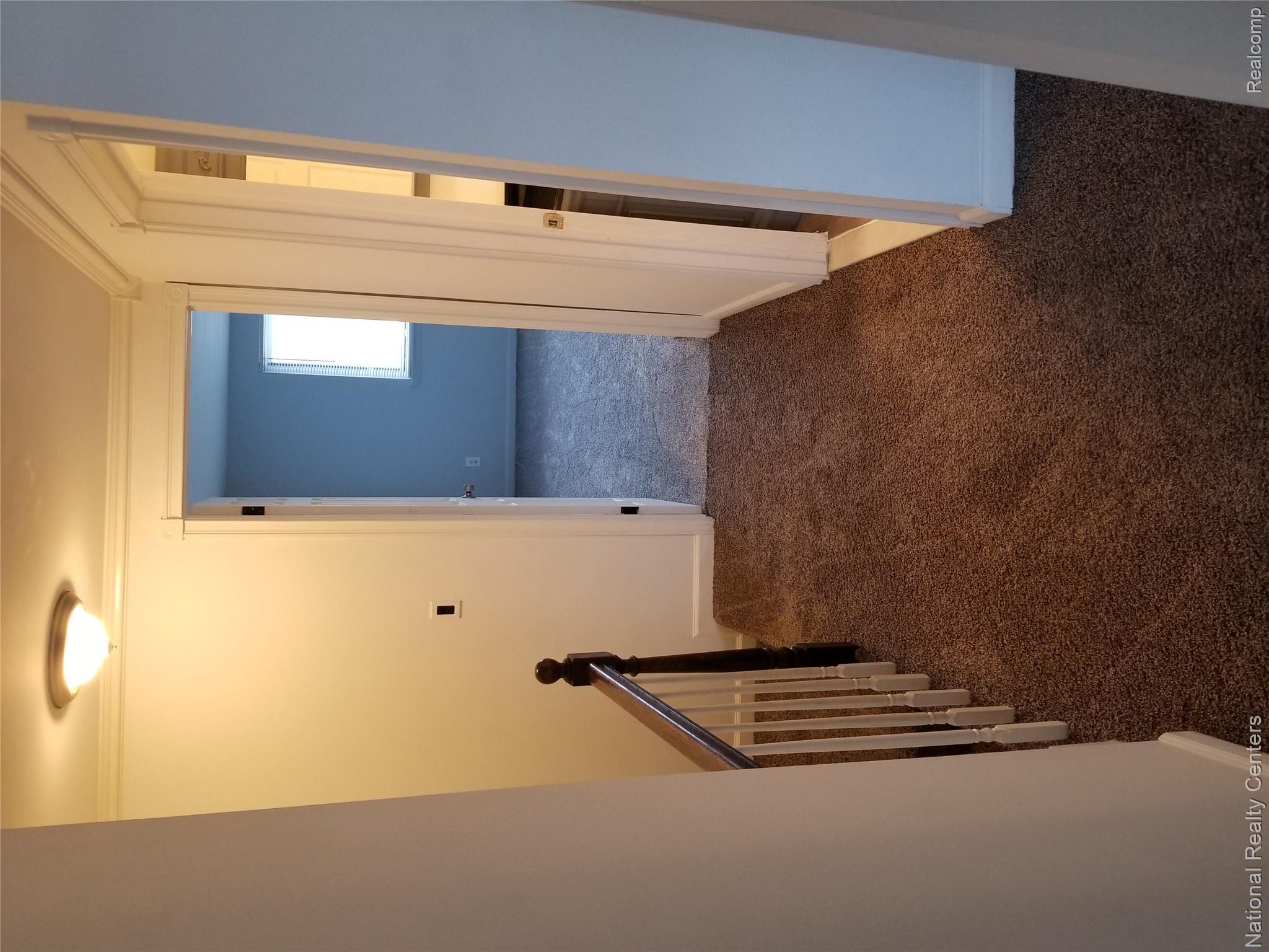 15175 Raphael Terrace Warren, MI 48088 - Photo 18 of 20 Carpeted hallway with white walls and crown molding