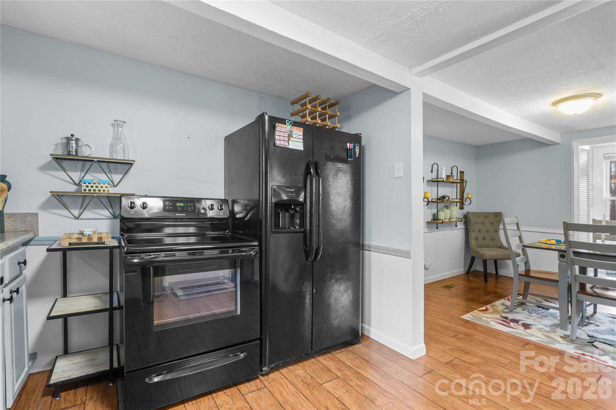 23 Maxwell Road Asheville, NC 28805 - Photo 12 of 47 a kitchen with stainless steel appliances granite countertop a refrigerator and a stove top oven