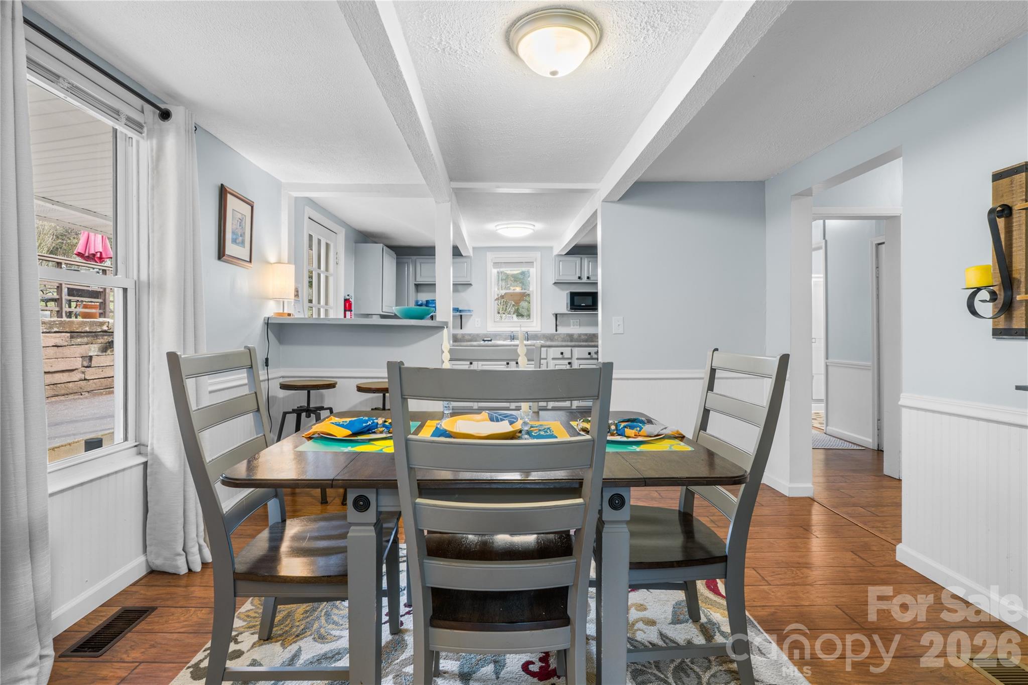 23 Maxwell Road Asheville, NC 28805 - Photo 13 of 47 a dining room with furniture and a kitchen view