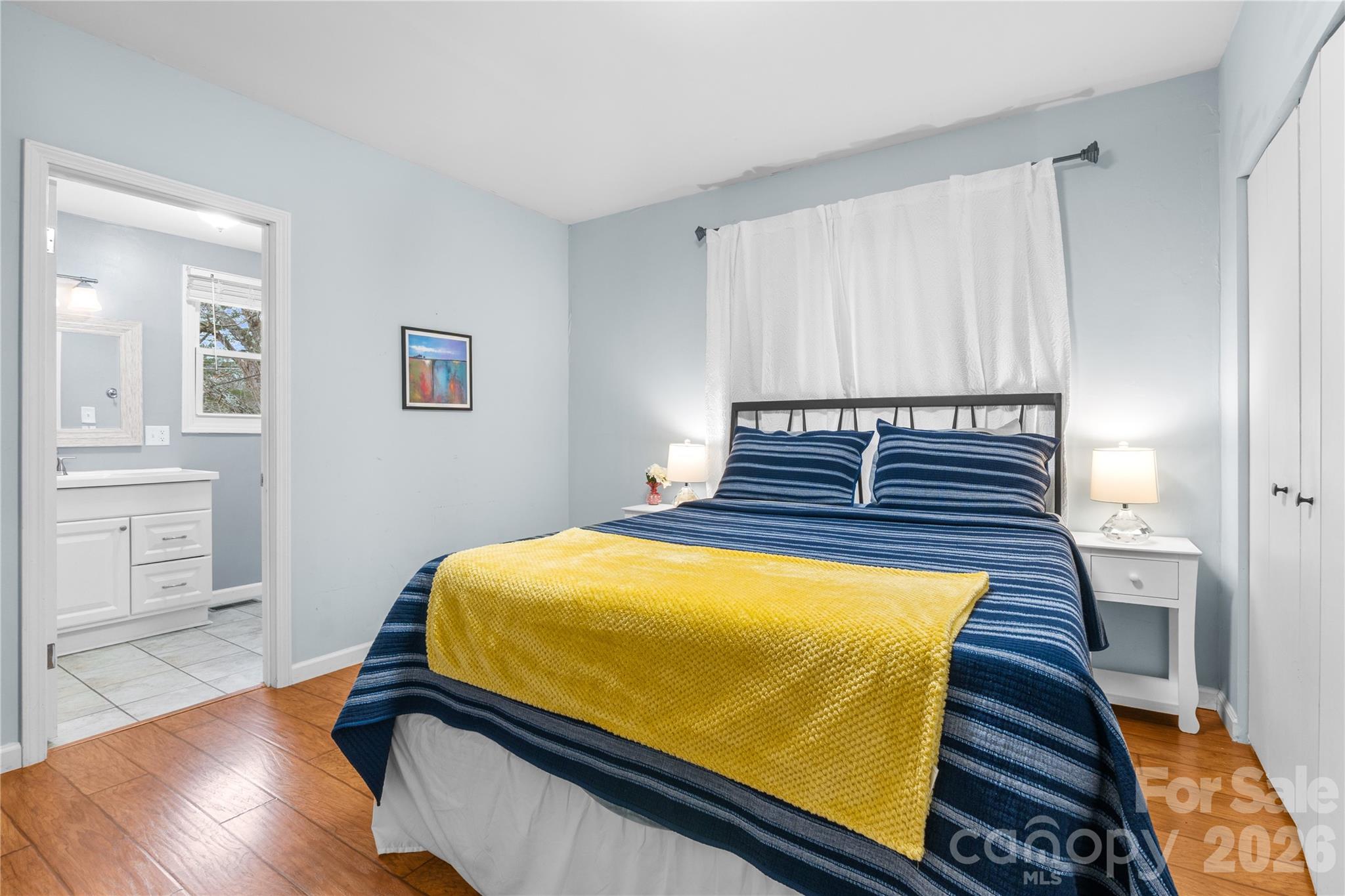 23 Maxwell Road Asheville, NC 28805 - Photo 22 of 47 a bed sitting in a bedroom next to a window
