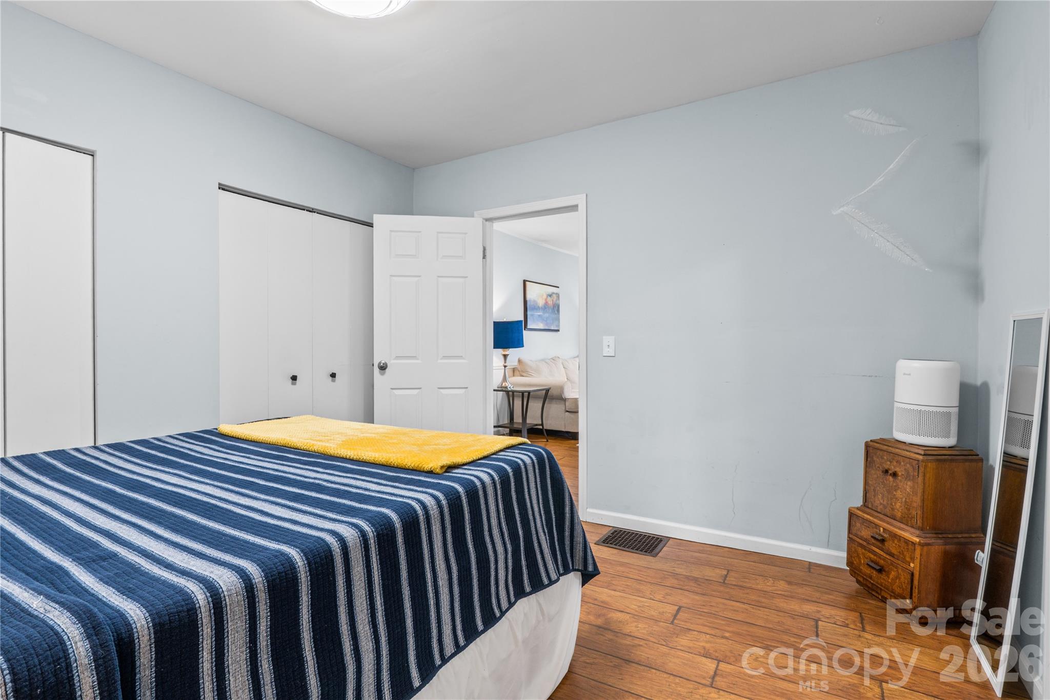 23 Maxwell Road Asheville, NC 28805 - Photo 23 of 47 a bedroom with a bed and wooden floor