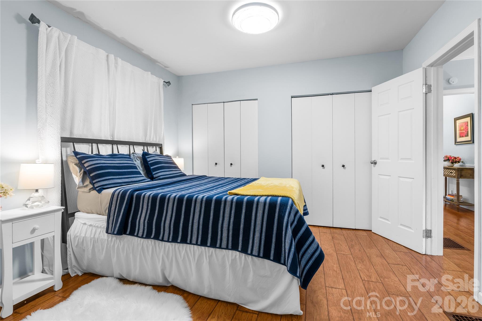 23 Maxwell Road Asheville, NC 28805 - Photo 24 of 47 a bedroom with a bed and wooden floor