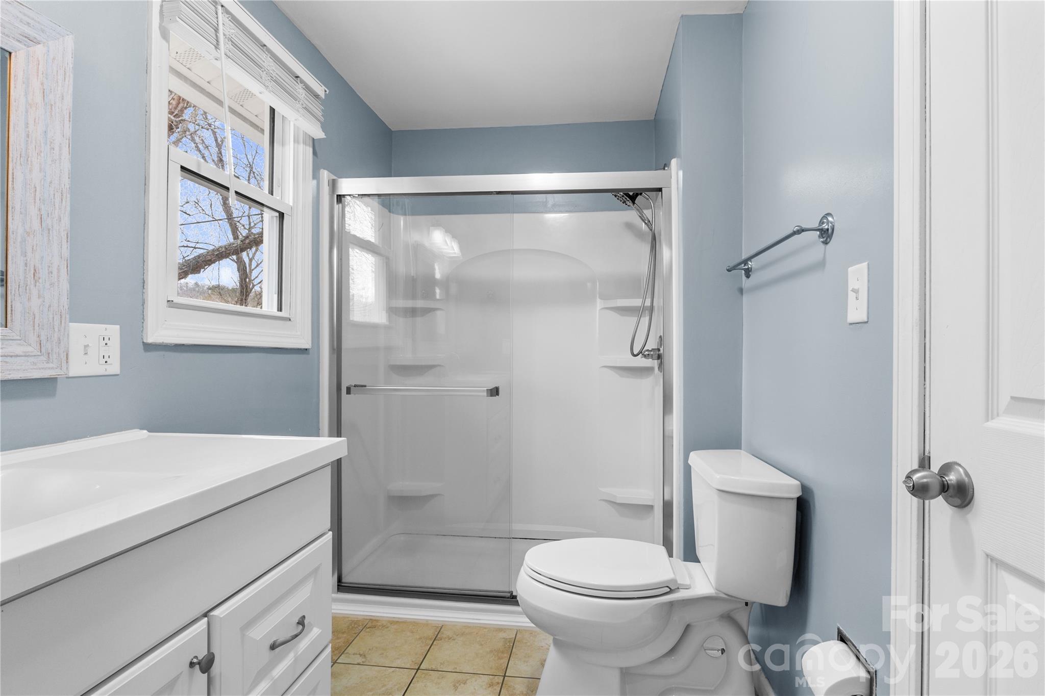 23 Maxwell Road Asheville, NC 28805 - Photo 25 of 47 a bathroom with a sink toilet and shower