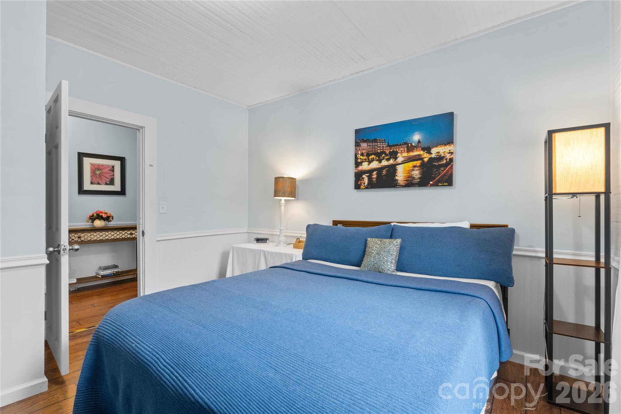 23 Maxwell Road Asheville, NC 28805 - Photo 28 of 47 a bedroom with a bed and a flat screen tv