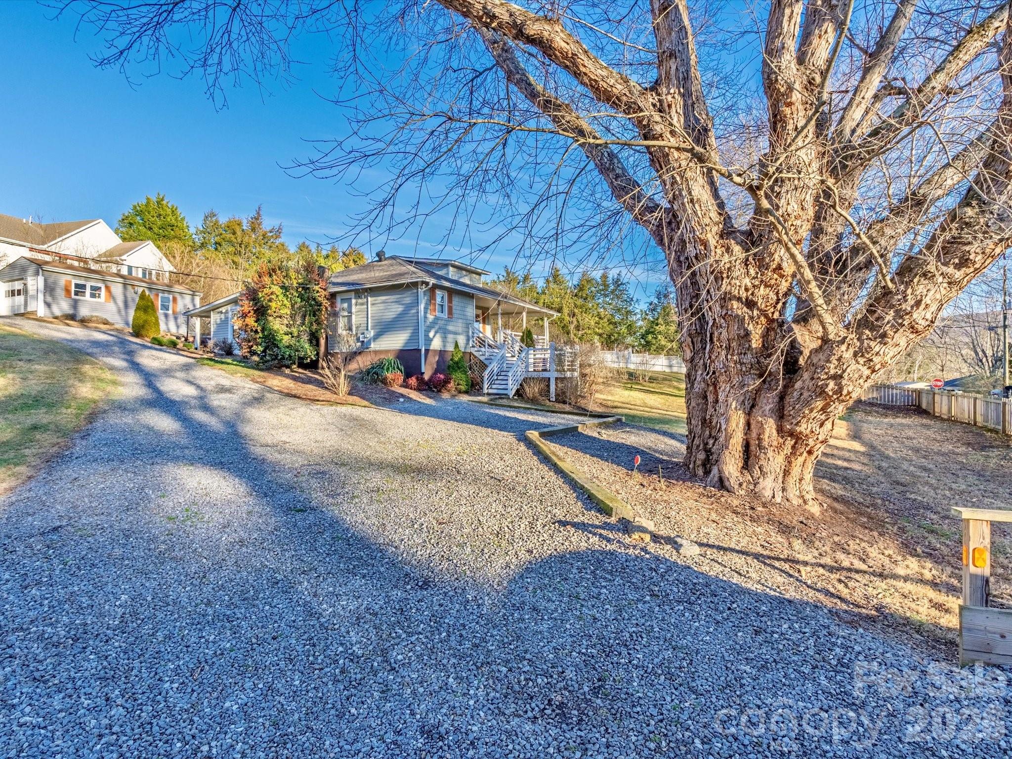 23 Maxwell Road Asheville, NC 28805 - Photo 33 of 47 a view of a street with a tree in the background