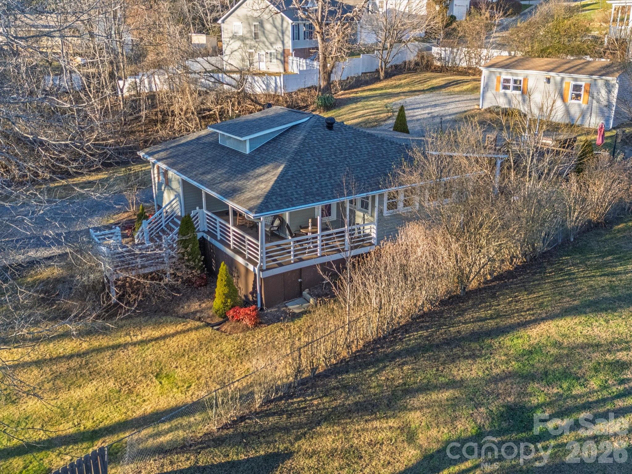 23 Maxwell Road Asheville, NC 28805 - Photo 47 of 47 a view of a house with a small yard and wooden fence
