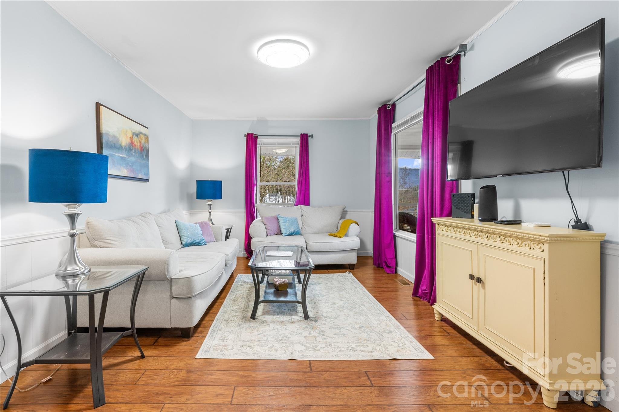 23 Maxwell Road Asheville, NC 28805 - Photo 7 of 47 a living room with furniture and a flat screen tv