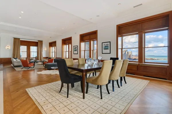 a dining room with furniture and window