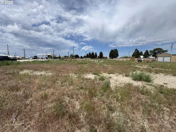 a bathroom with a sink mirror and shower