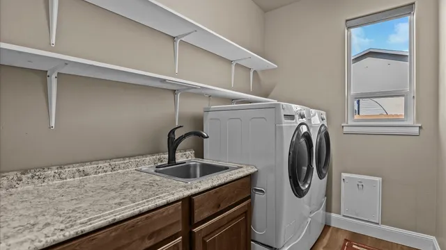 a bathroom with a sink and mirror